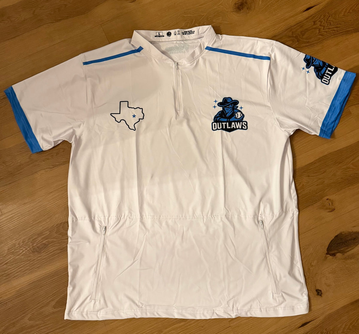 White Outlaws quarter-zip performance top with Texas mascot chest graphic, no hood