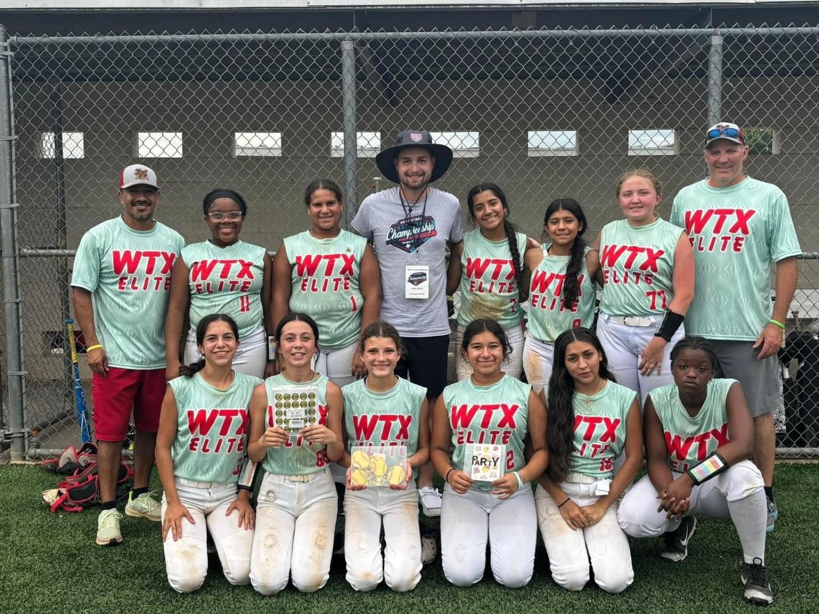 Youth softball team in custom mint uniforms